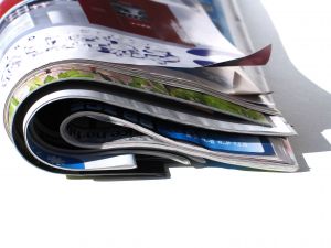 Christian Computing Magazine newspaper rolled up