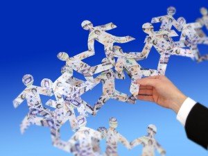 image resembling a person holding several paper money people interwined with each other