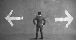 Man deciding which way to go in regards to church management systems.