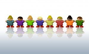 Toy kids standing hand to hand resembling church members