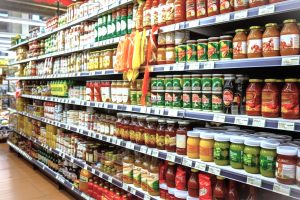 picture of a grocery produce isle which is symbolic of a consumer or producer type of person