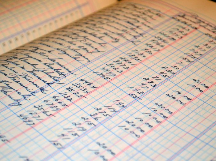 Old paper style church accounting ledger that shows numbers on each line along with the names that money went too.