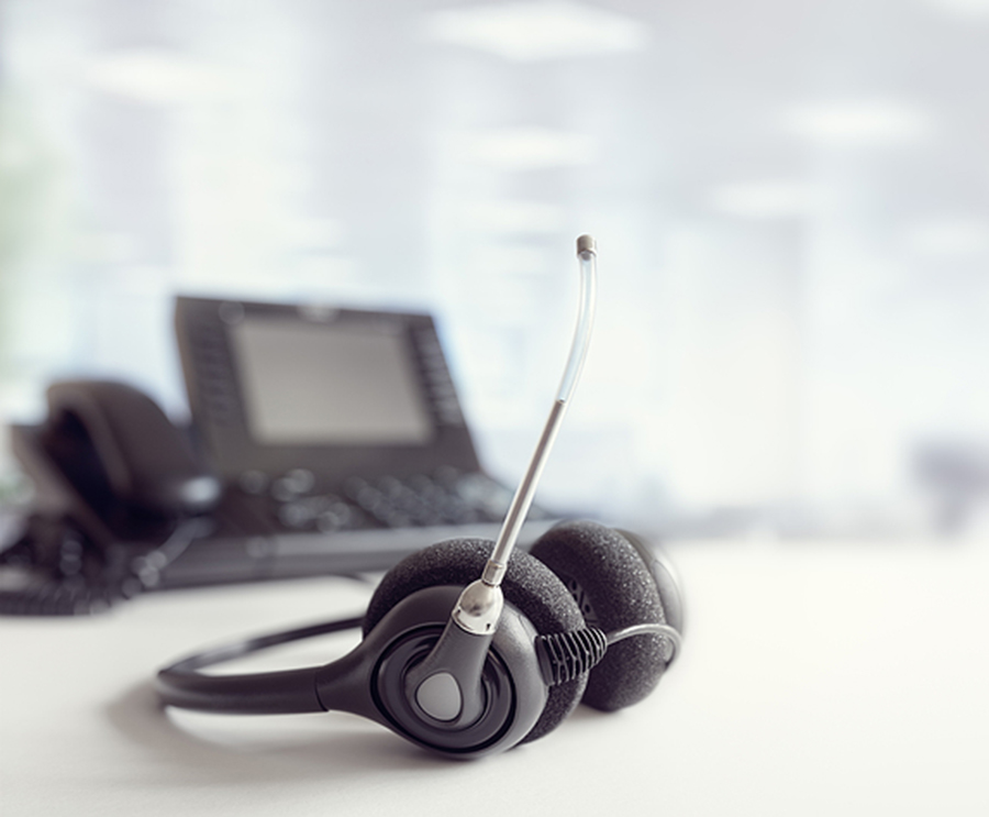Phone and headphone set which shows the equipment used during a sales and training webinar.