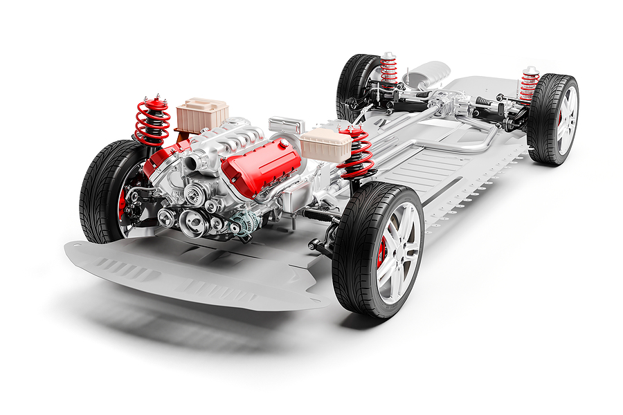 3d car chassis with motor, wheels and suspension, on white background.