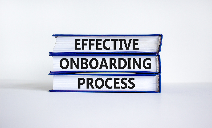 Three books with the words 'effective onboarding process' on the edge of the books.