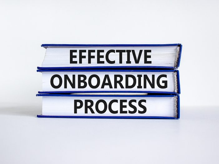 Three books with the words 'effective onboarding process' on the edge of the books.